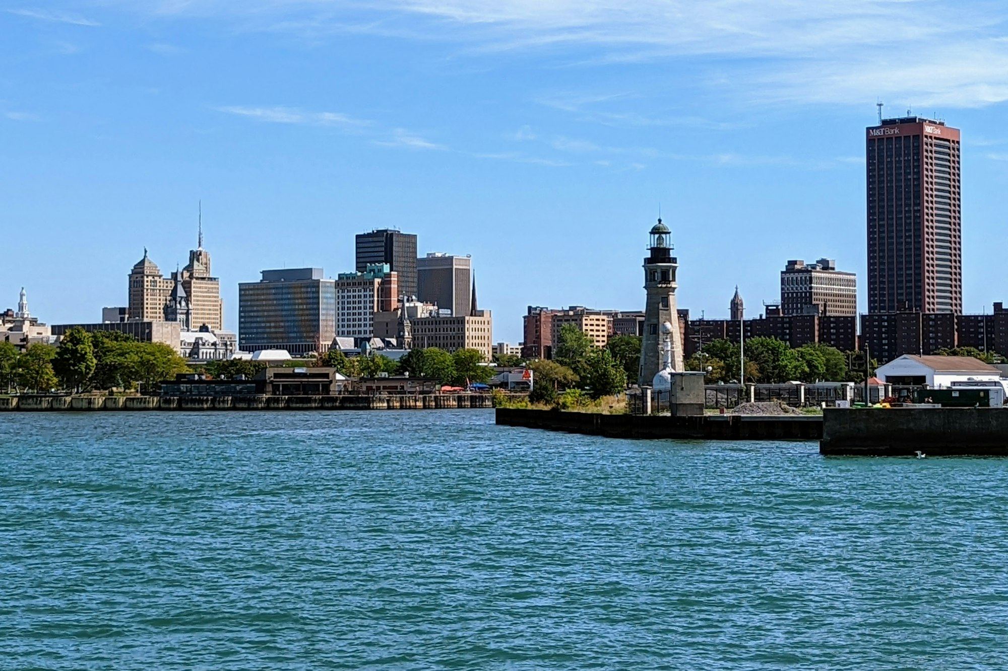 Buffalo waterfront and lighthouse across the water on a clear day